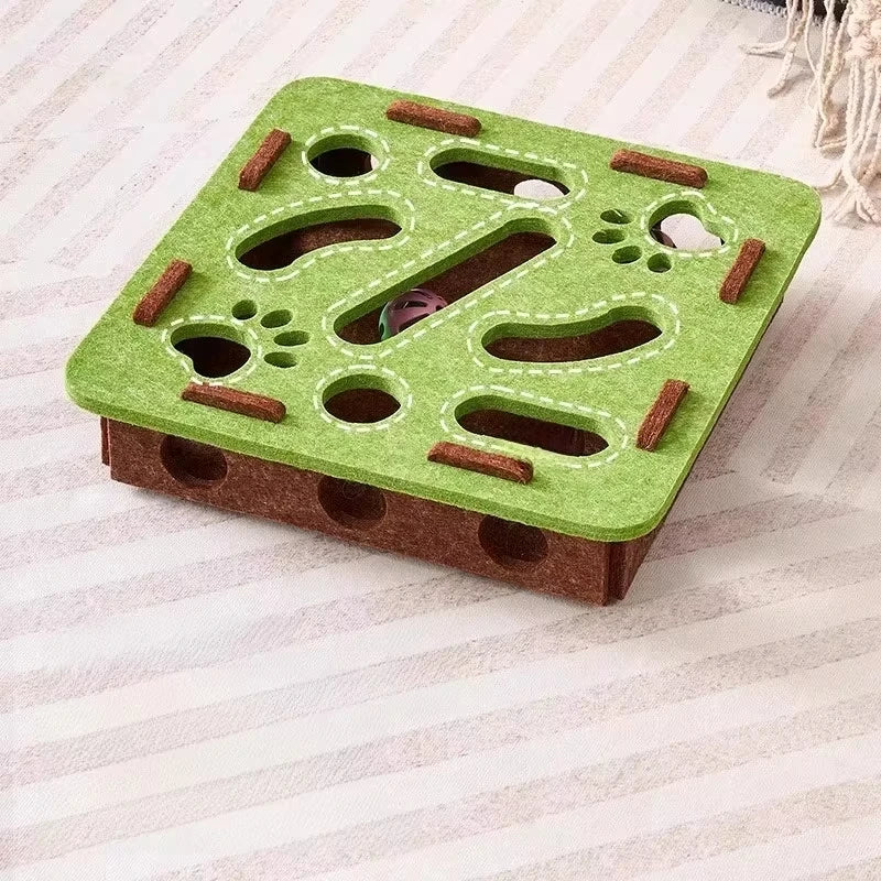 Green felt slow feeder puzzle toy with treat holes and bone-shaped cutouts for dogs