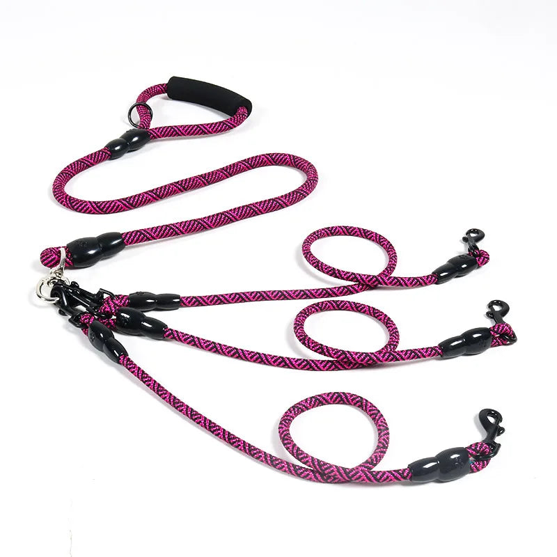 Pink patterned dog leash with black handle and clips, ideal for walks and pet essentials