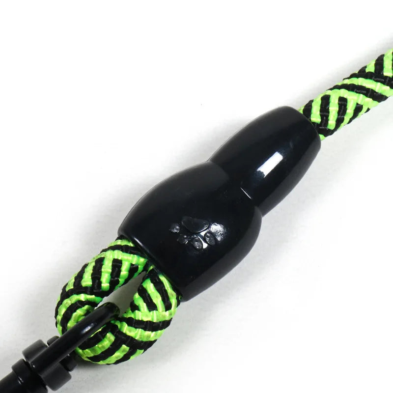 Neon green and black braided dog leash with paw print handle